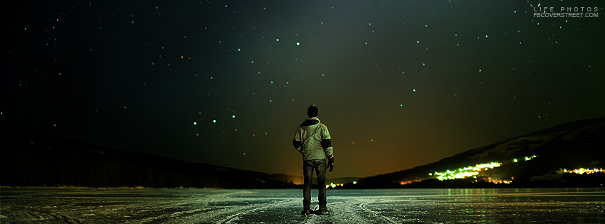 Wintertime Guy Facing The Stars Wallpaper